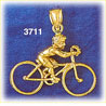 14k gold boy riding bike charm